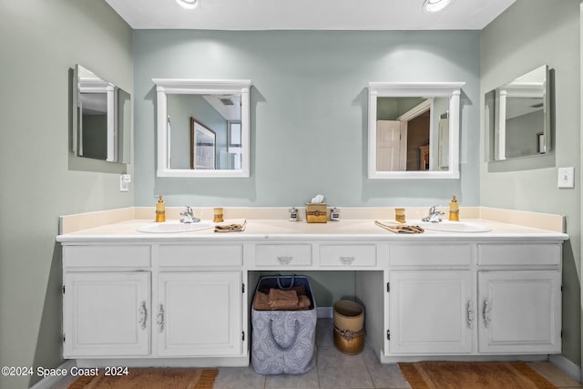 bathroom featuring tile patterned flooring and double sink vanity