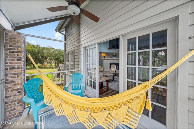 exterior space with ceiling fan