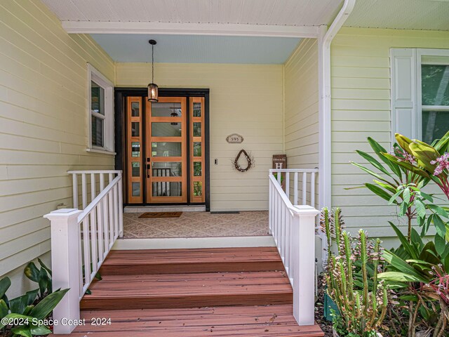 doorway to property featuring covered porch