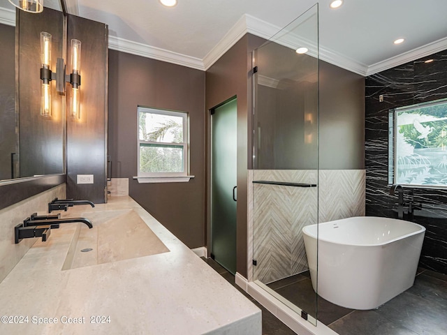 bathroom with crown molding, separate shower and tub, tile patterned flooring, tile walls, and sink