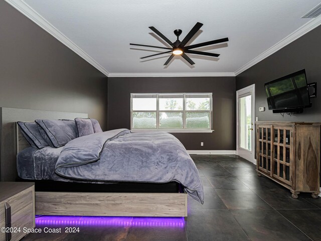 tiled bedroom with ceiling fan and crown molding