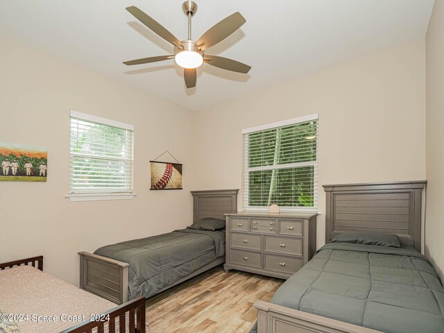 bedroom featuring light wood-type flooring and ceiling fan