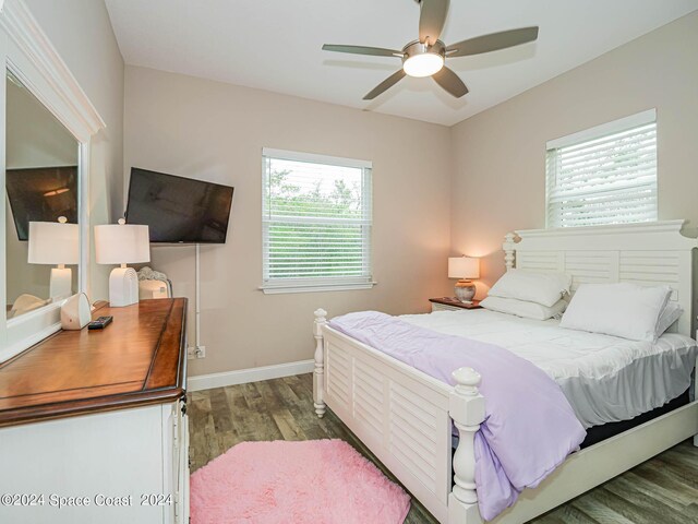 bedroom with ceiling fan and hardwood / wood-style flooring