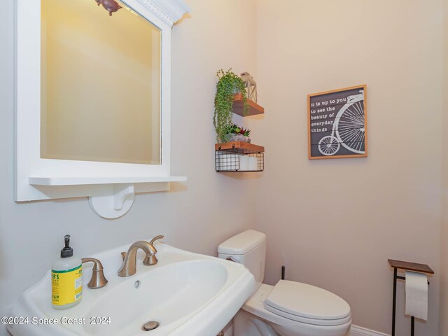 bathroom with sink and toilet