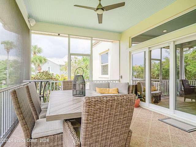 sunroom with ceiling fan and a healthy amount of sunlight