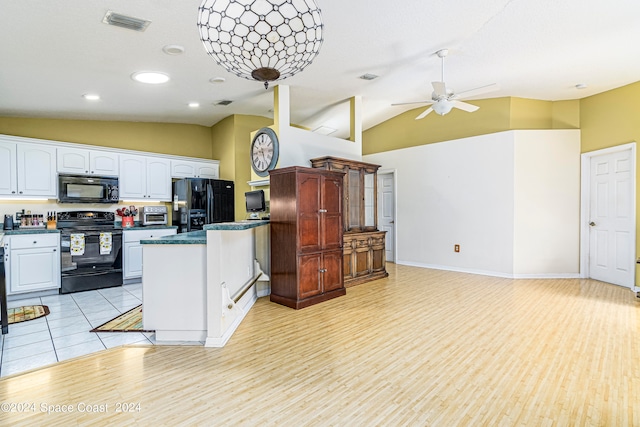 kitchen with white cabinets, light hardwood / wood-style flooring, vaulted ceiling, black appliances, and ceiling fan