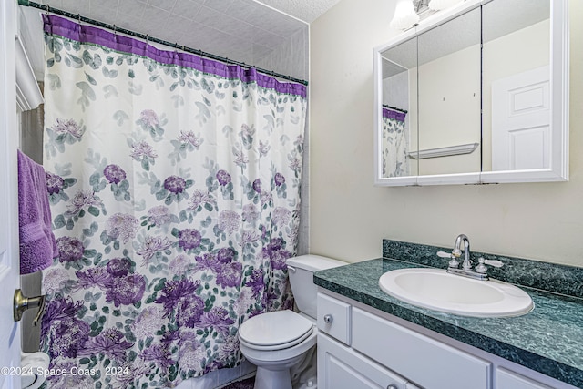 bathroom featuring a shower with curtain, toilet, a textured ceiling, and vanity