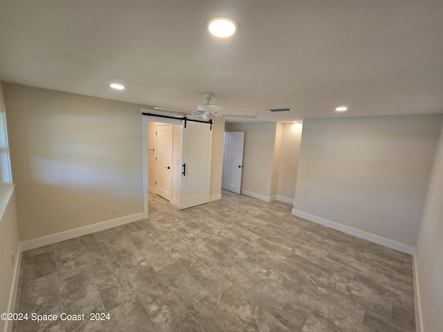 empty room featuring a barn door