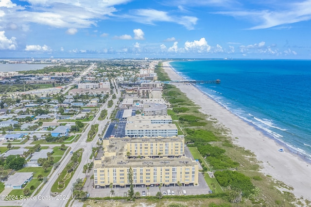 aerial view featuring a view of the beach and a water view