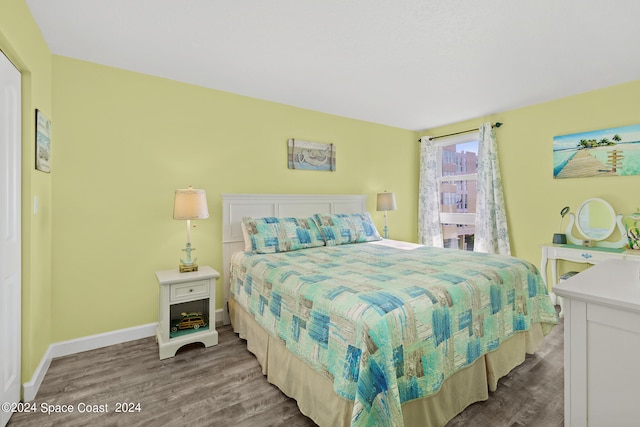 bedroom with hardwood / wood-style flooring