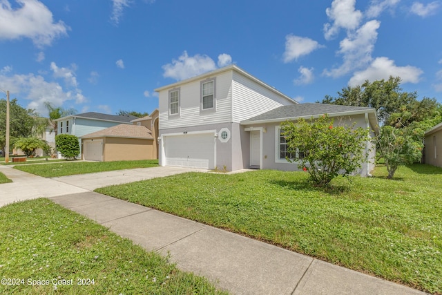 view of front of house with a garage, concrete driveway, and a front lawn