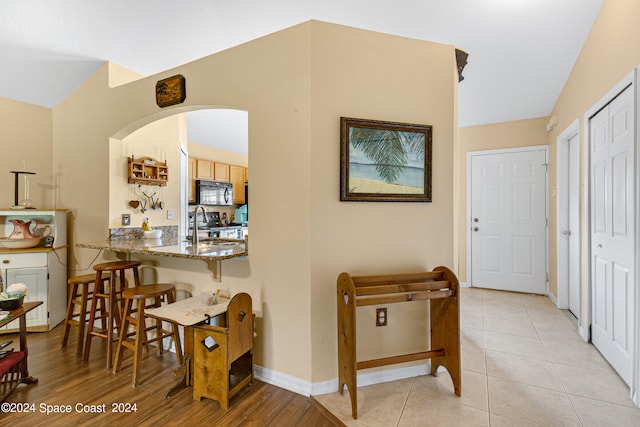 hallway with light hardwood / wood-style flooring