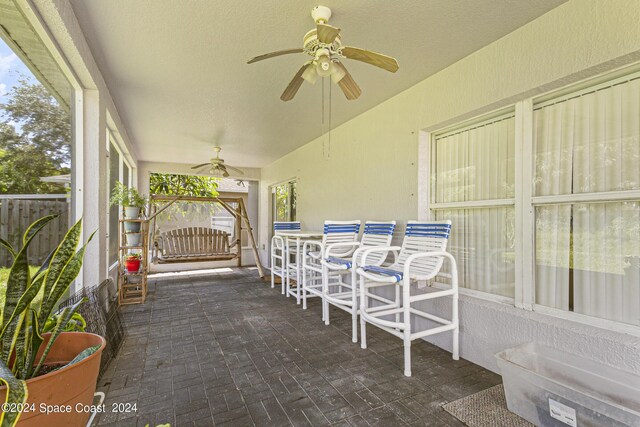 sunroom / solarium with ceiling fan and a wealth of natural light