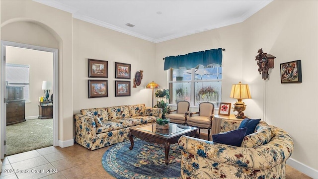 tiled living room with ornamental molding and a healthy amount of sunlight