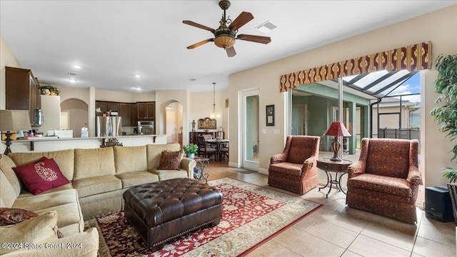 living room with light tile patterned floors and ceiling fan