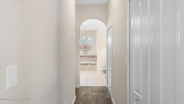 hallway featuring tile patterned floors