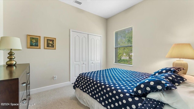 carpeted bedroom with a closet