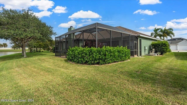 view of yard with glass enclosure