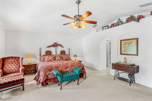 bedroom with ceiling fan, light colored carpet, and lofted ceiling