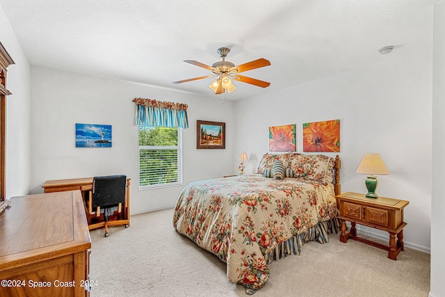 bedroom featuring ceiling fan and carpet floors