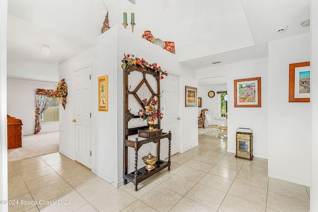 corridor featuring light tile patterned flooring