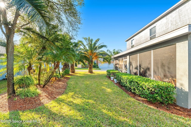 view of yard with a sunroom