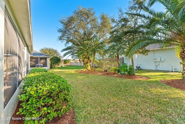 view of yard with a sunroom