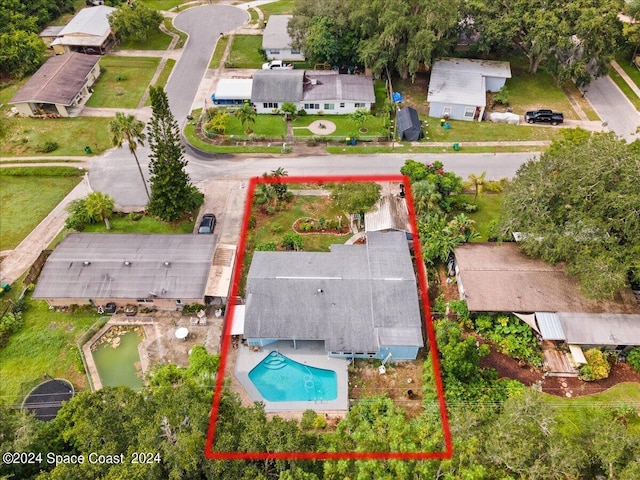 birds eye view of property with a residential view