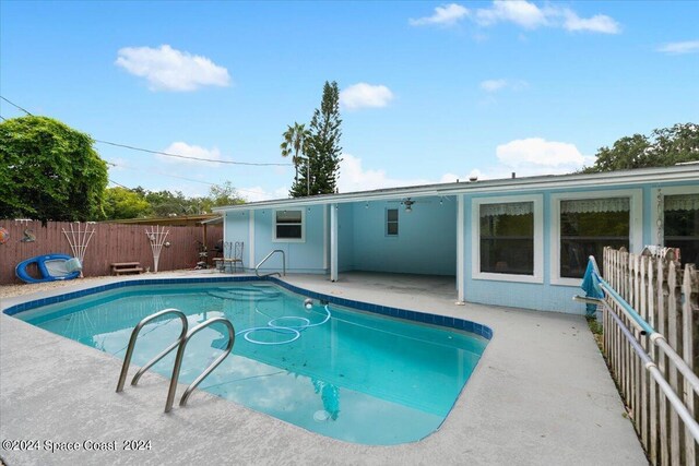 view of pool featuring a patio