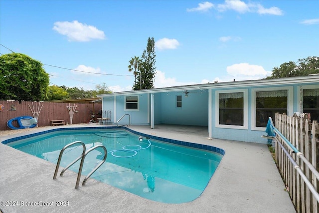 view of pool with a fenced in pool, a fenced backyard, and a patio