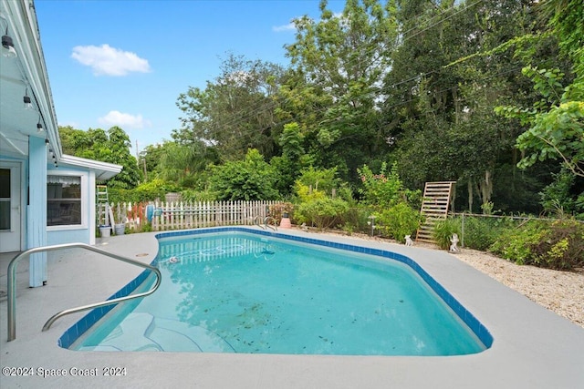 view of swimming pool with fence private yard, stairs, and a fenced in pool