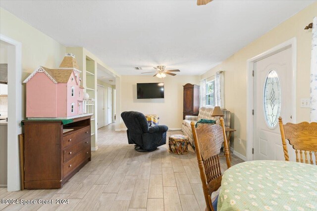 dining space featuring ceiling fan and light hardwood / wood-style flooring