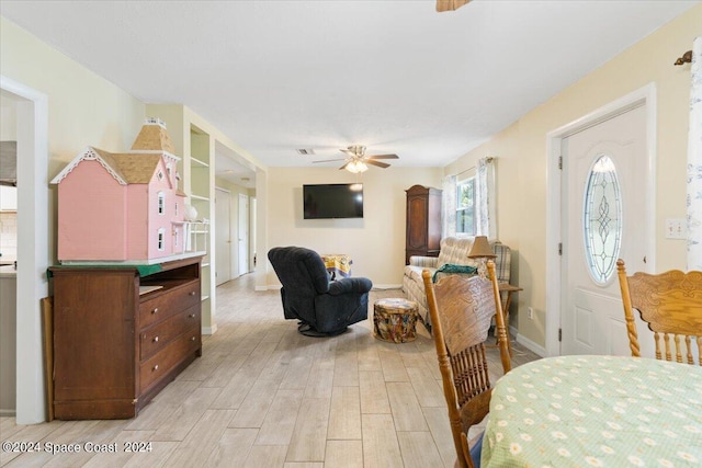 bedroom with ceiling fan and light wood-style floors