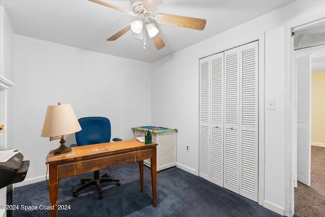 office area with ceiling fan, dark colored carpet, and baseboards