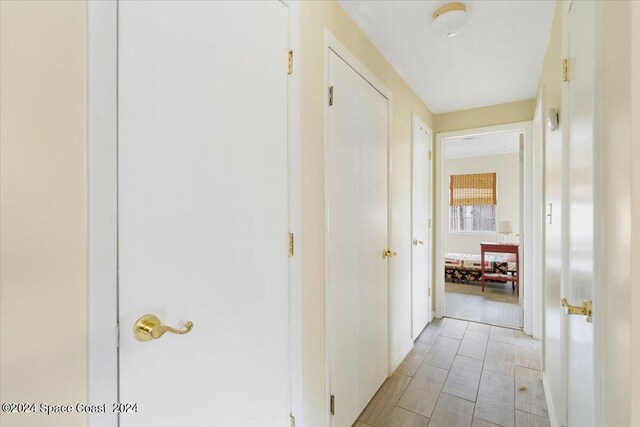 hall with light hardwood / wood-style flooring