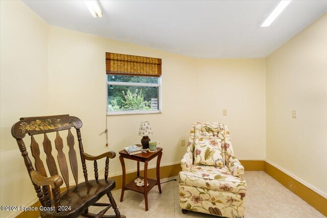 sitting room with light tile patterned floors