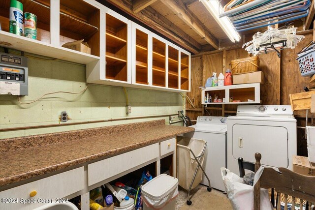 laundry room featuring washing machine and clothes dryer