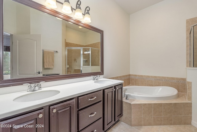 bathroom with dual bowl vanity, shower with separate bathtub, and tile patterned flooring