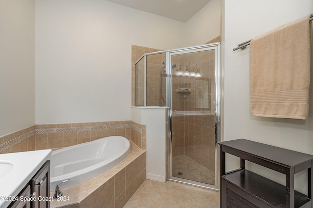 bathroom featuring vanity, tile patterned flooring, and independent shower and bath