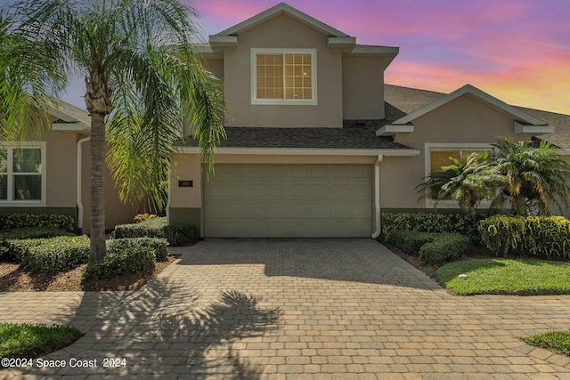 view of front of property featuring a garage