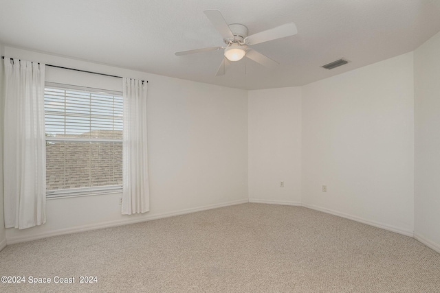 unfurnished room with carpet floors and ceiling fan