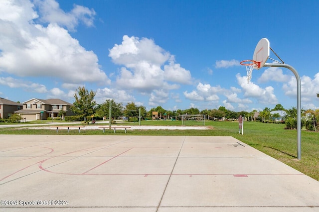 view of basketball court with a lawn and volleyball court