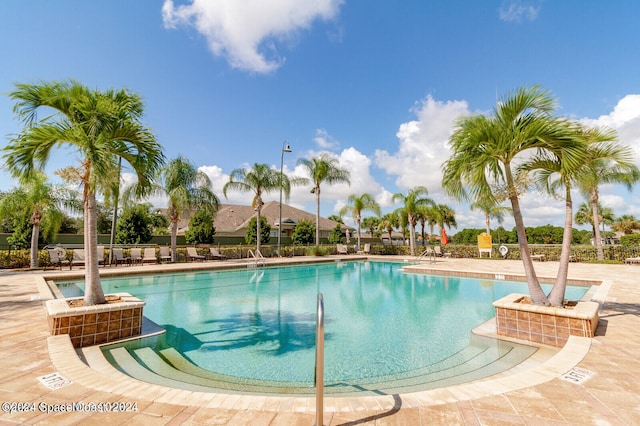 view of swimming pool with a patio