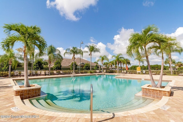 view of pool featuring a patio