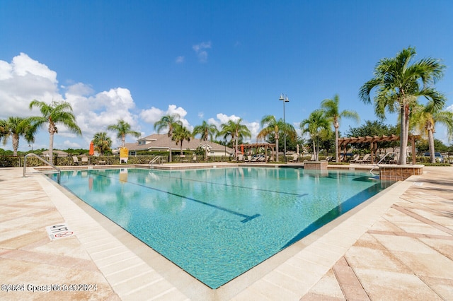 view of swimming pool featuring a pergola