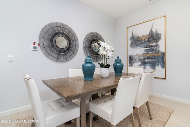 dining space featuring hardwood / wood-style flooring