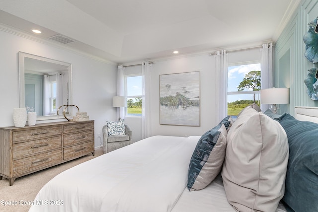 bedroom with ornamental molding and light colored carpet