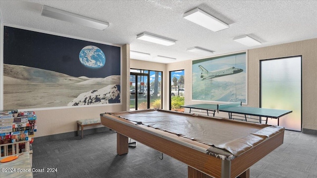 game room featuring billiards, a textured ceiling, and carpet flooring