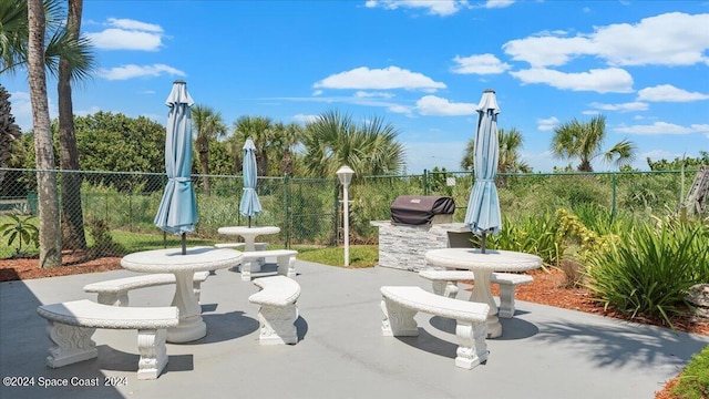 view of home's community featuring a patio area and fence