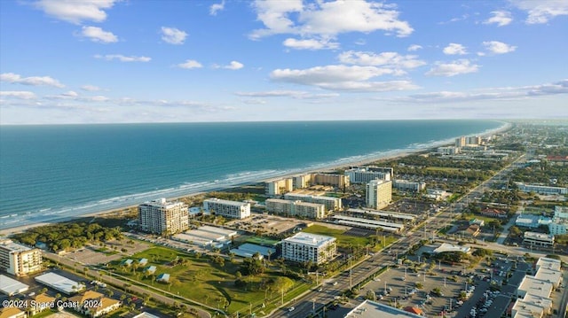 drone / aerial view featuring a water view and a view of city